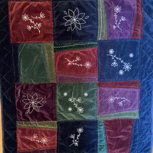 Beautiful embroidered velvet quilt in warm jewel tones